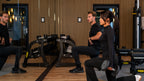 Personal trainer David showing exercises to his client while in a personal training session
