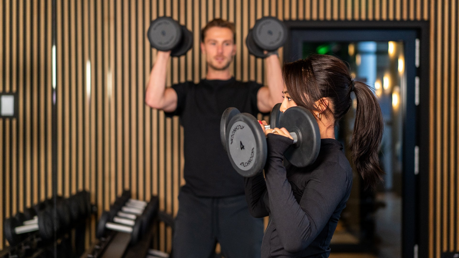 Personal trainer with his client in a personal training session in Amsterdam